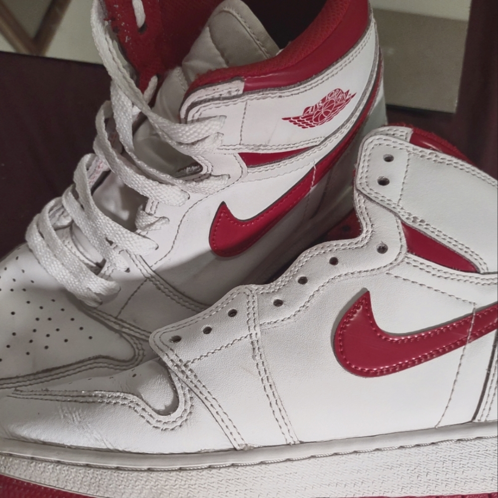 Nike metallic red jordan 1s